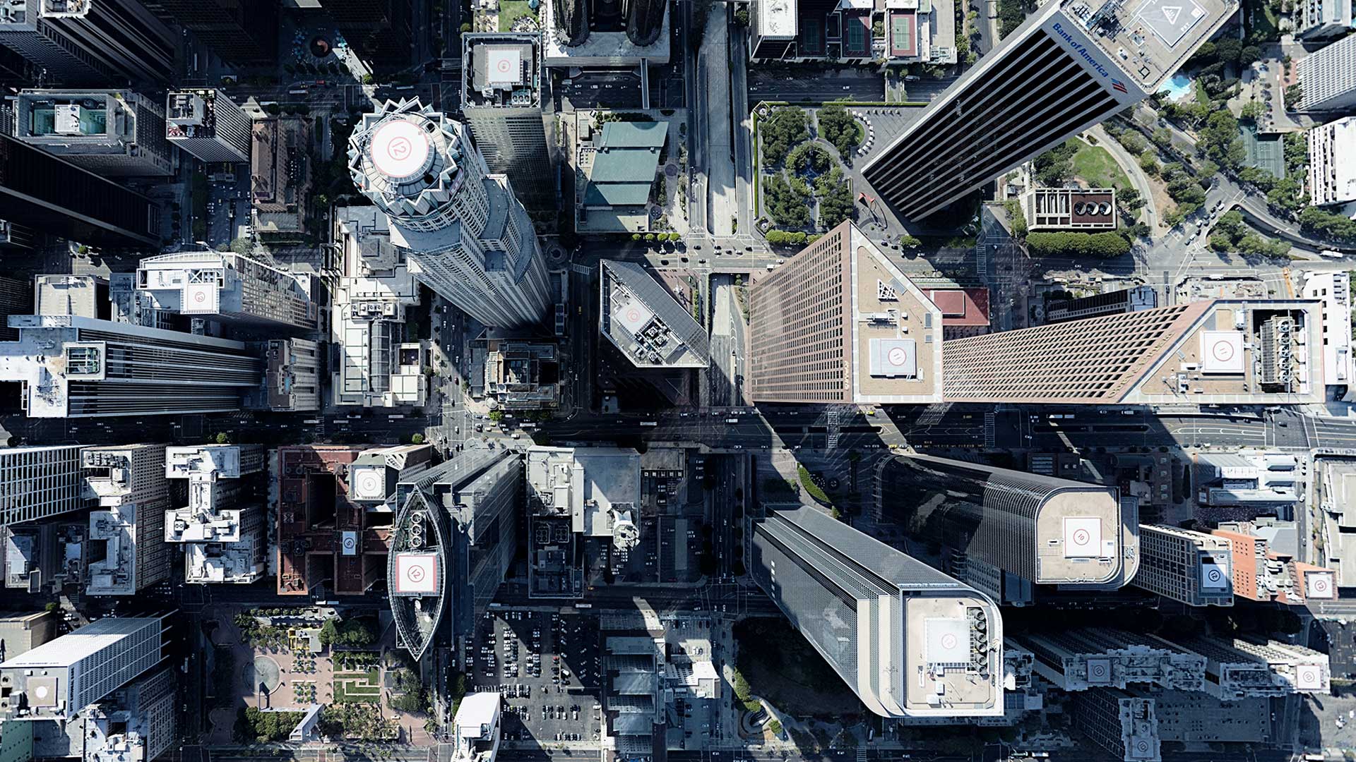 Aerial view looking down at skyscraper buildings tops in a city
