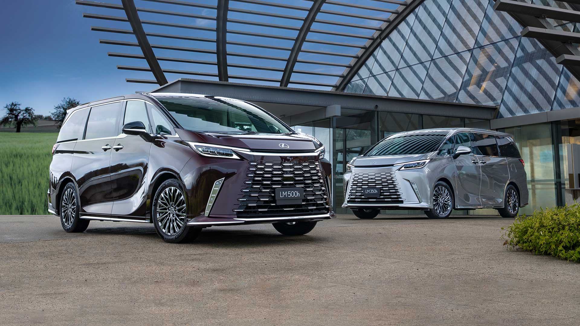 2024 Lexus LM 500h (L) and LM 350h (R). LM 500h overseas pre-production model shown. Australian grades, features & specifications may differ.